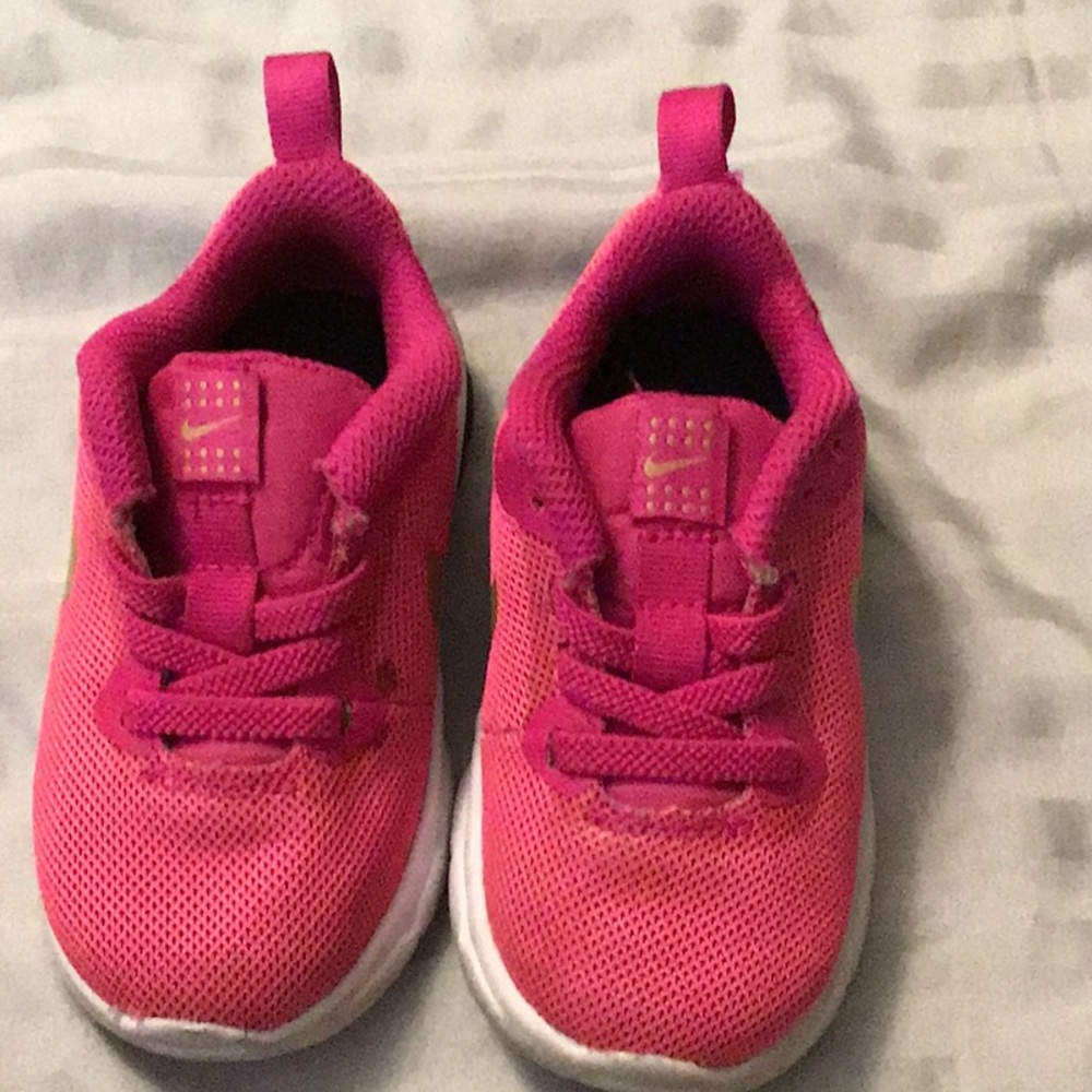 Hot pink children’s Nike’s.
